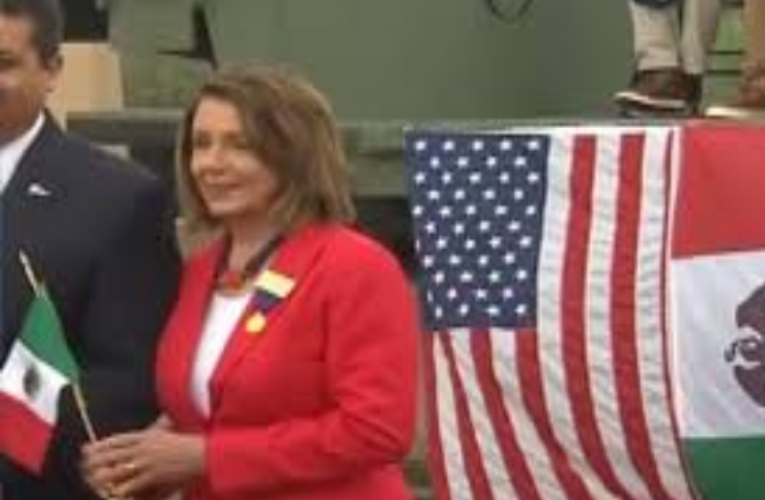 Pelosi caught on camera waving Mexican flag on border giving hugs to migrants